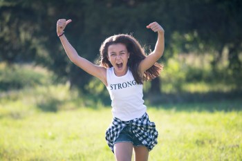 a picture of a girl who just heard inspiring words, like quotes for a daughter, from her parent