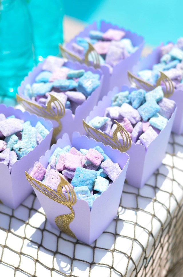 Violet and blue treats sit waiting for a mermaid themed birthday idea for kids