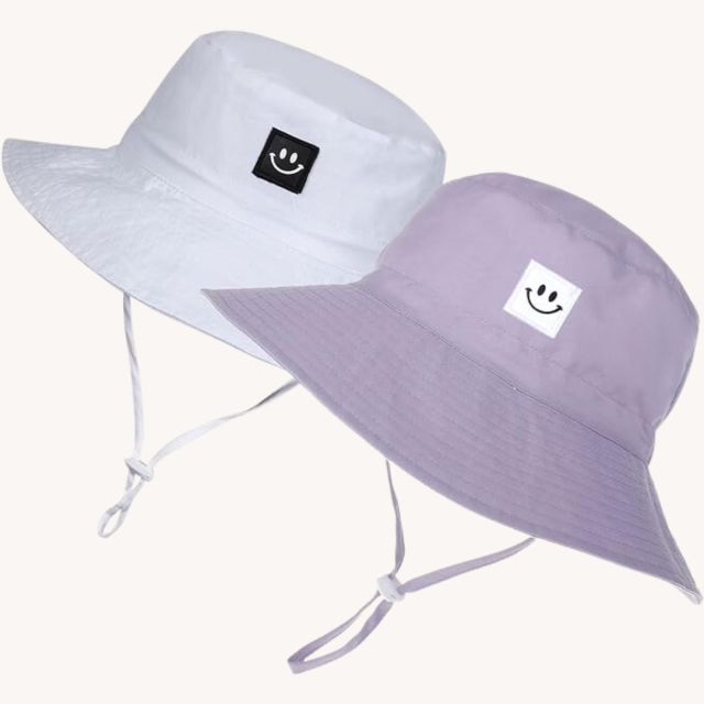two bucket sun hats with smiley faces