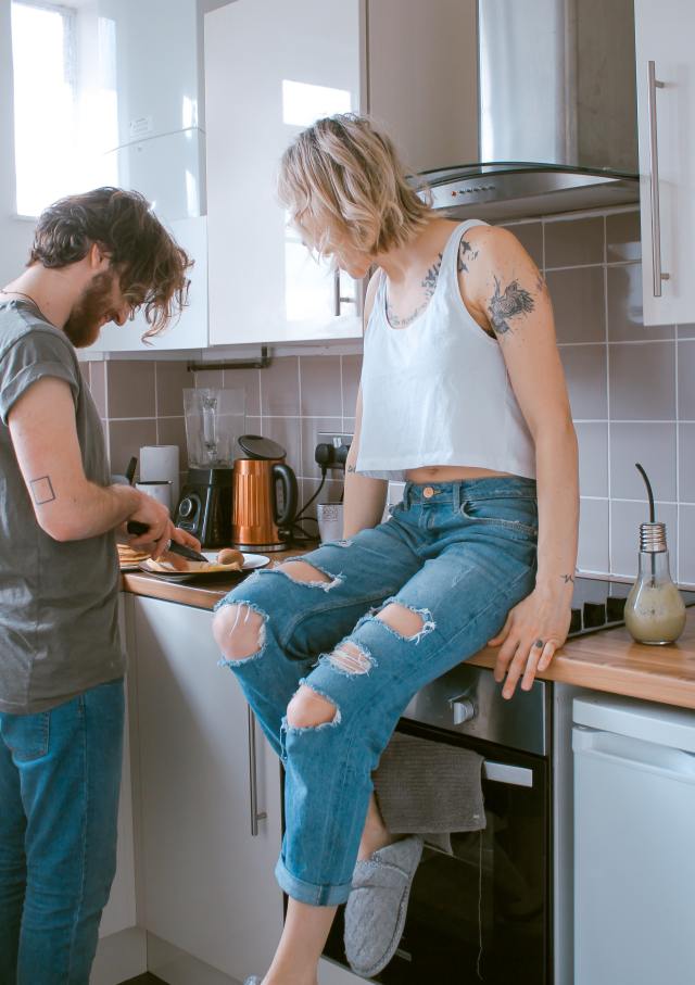 a couple enjoying a cooking lesson, which is a great at-home date night idea.