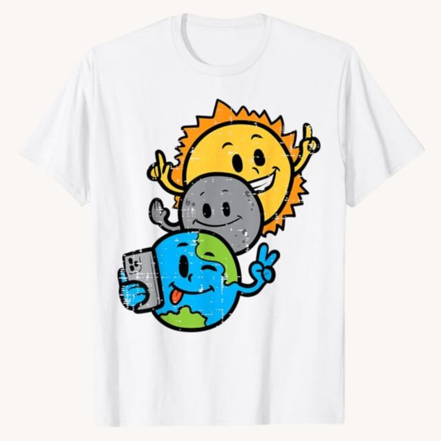 white t-shirt with earth, moon, and sun illustration all taking a selfie