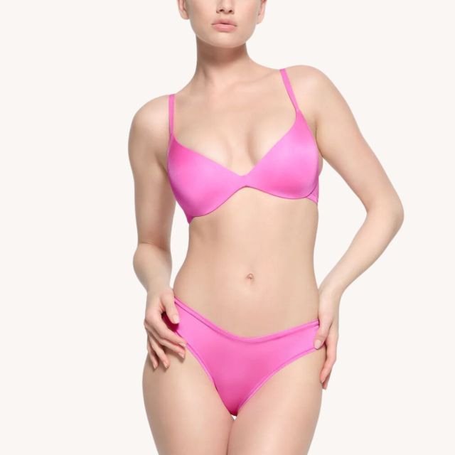 woman wearing hot pink bra and underwear