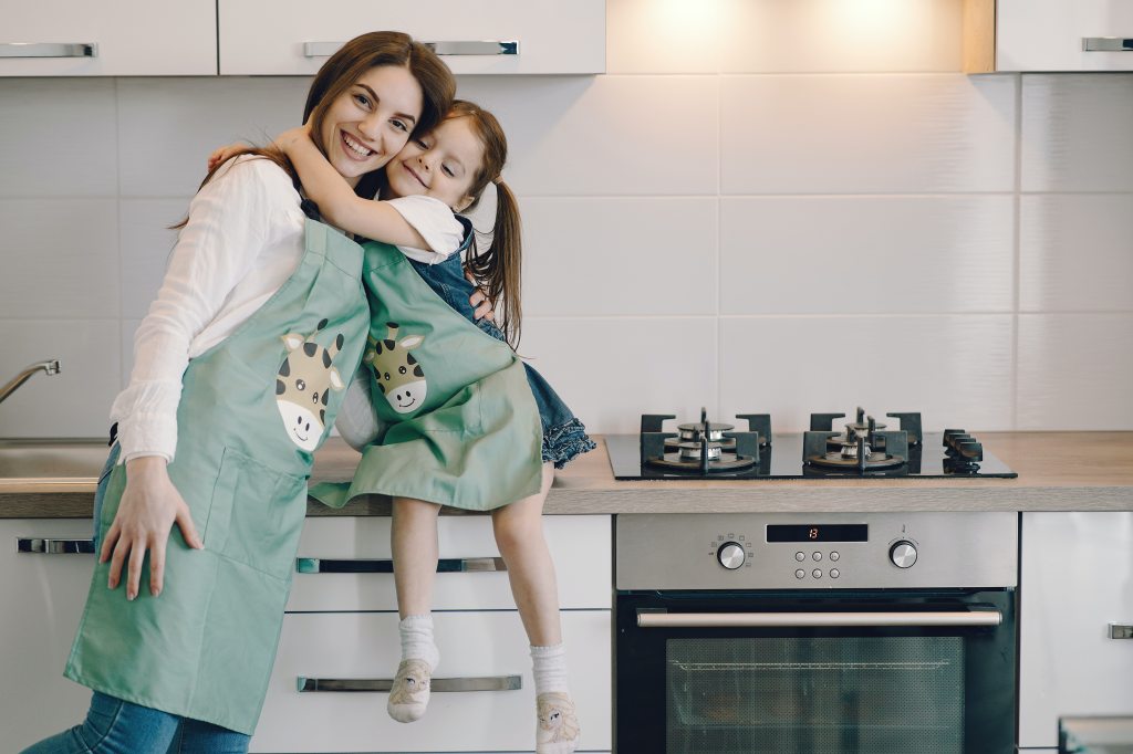 Girl and mom in kitchen