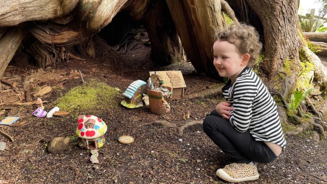 A kid finds a fairy house along the trails of Seabrook wa