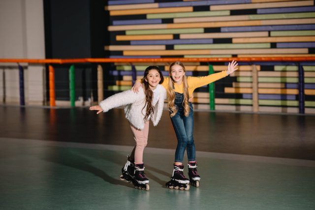 two girls roller skating