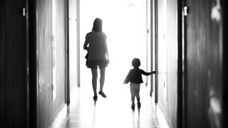 mom and kid walking