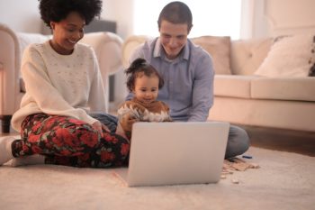 family around laptop