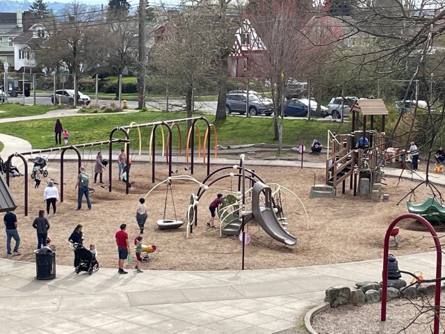 Families on the playground at Maple Leaf Park, one of Seattle's best picnic spots