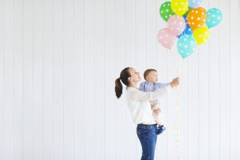 Playing with balloons is one option for how to celebrate first birthday without a party