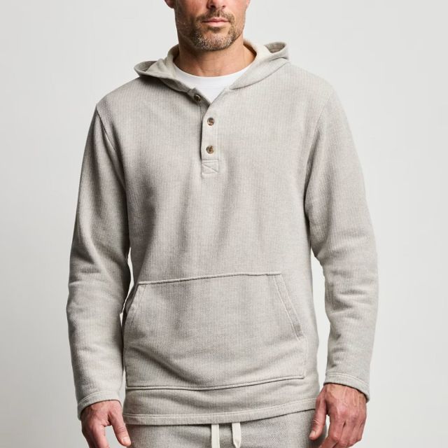 man wearing stone-colored henley hoodie