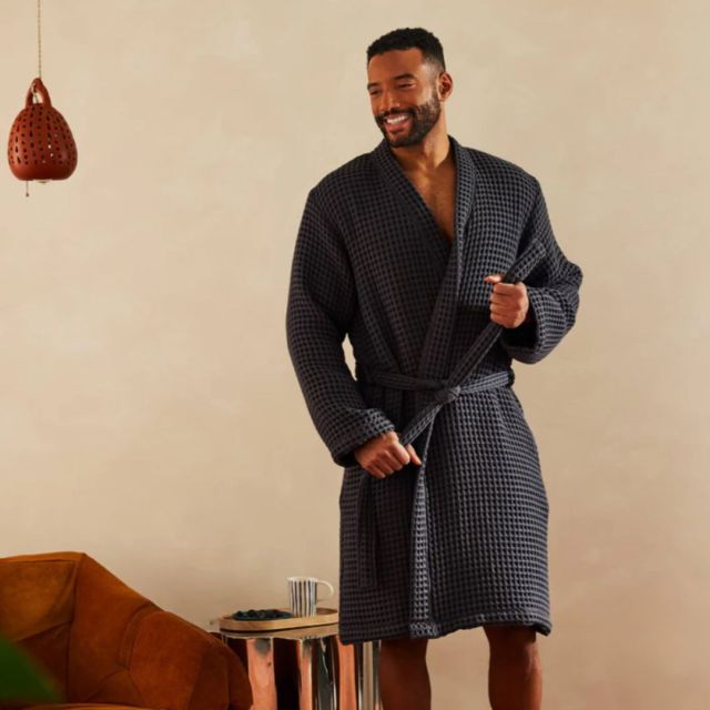 man wearing grey waffle bathrobe