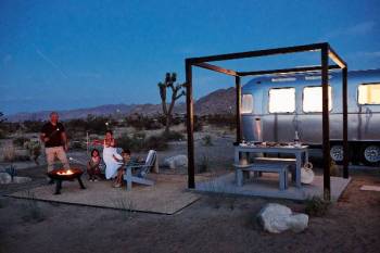 Family roasting marshmallows in Joshua Tree at AutoCamp