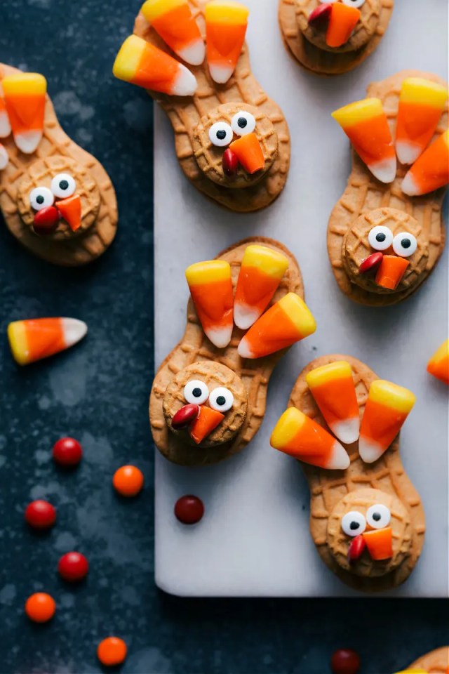 Nutter Butter turkey cookies decorated with candy corn as a Thanksgiving dessert that isn't pie
