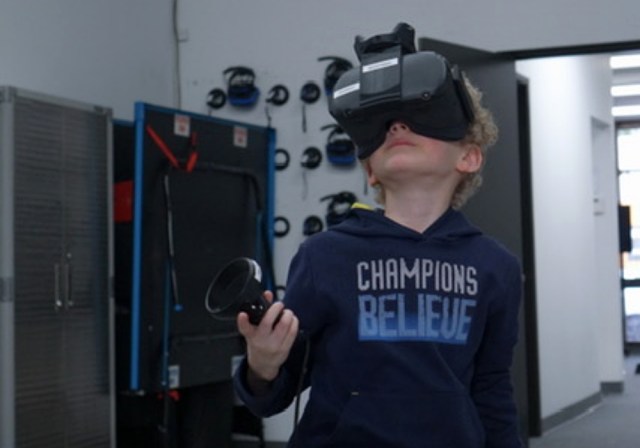 Boy with VR equipment