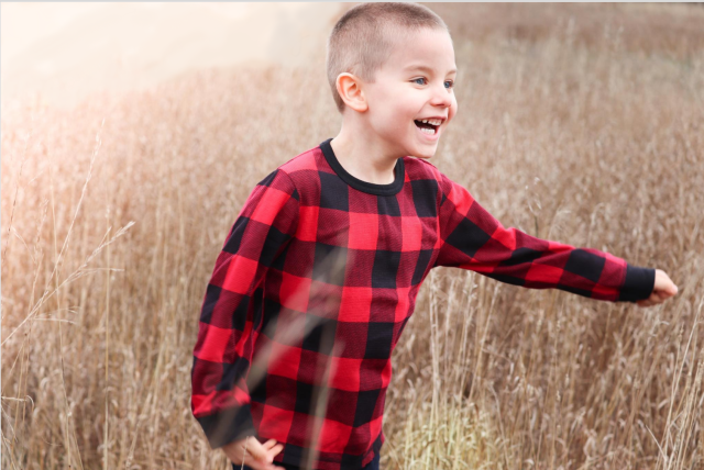 little boy in a field