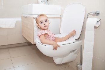 a kid sitting backwards on the potty for a funny roundup of potty training memes