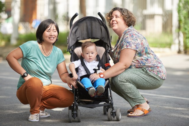 Pride moms with their baby in a stroller