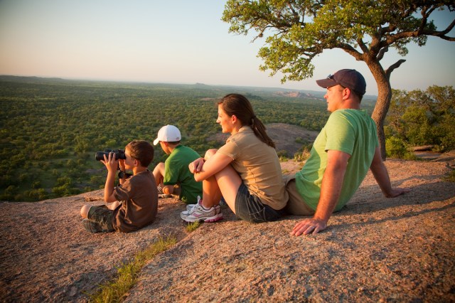 family enjoying Enchanted Rock one of the best things to do in Fredericksburg TX with kids