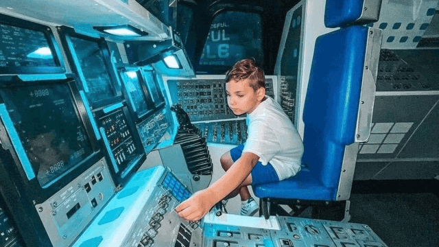 young boy exploring the Kennedy Space Center