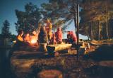 summer campers around a campfire