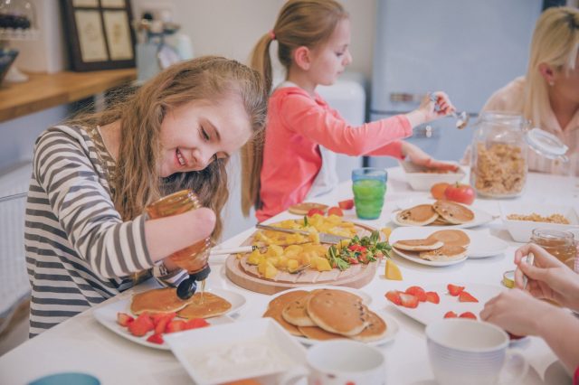 family-cooking-diveristy-amputee-pancakes-istock