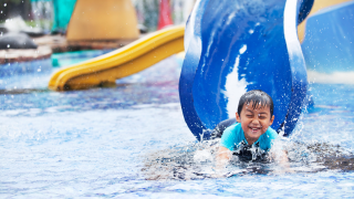 little boy enjoying a water park in Dallas Texas