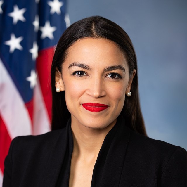 A portrait of LatinX hero Alexandria Ocasio-Cortez, the youngest woman ever to serve in the United States Congress, in front of an American flag