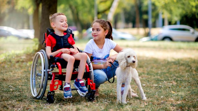 boy in a wheelchair with girl