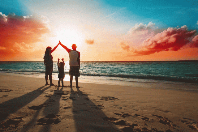 A family starts a new tradition of watching the sunset together at the beach
