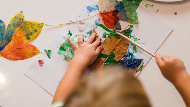 painting leaves is a fun fall birthday party idea