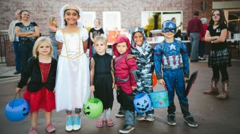 group of kids in Halloween costumes