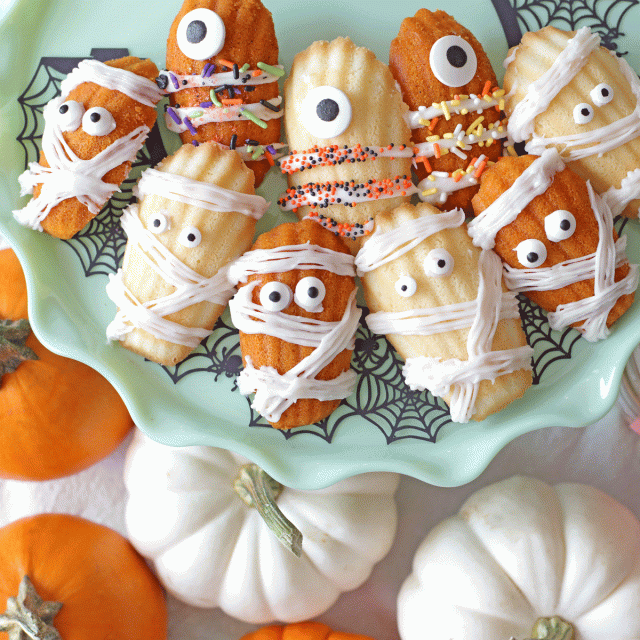 Madeleine cookies are decorated to look like mummies and Minions for Halloween treats