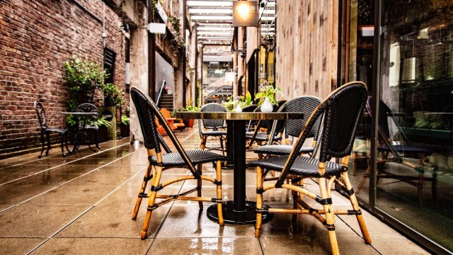 Portland restaurants with outdoor seating like this one, chairs, table on a rainy day outside