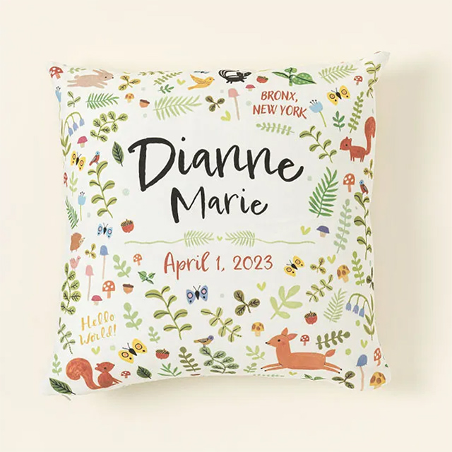 Uncommon Goods' personalized woodland nursery pillow is one of our splurge-worthy baby keepsake gifts