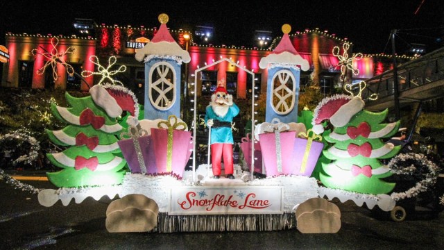 a float with an elf goes by at Snowflake Lane a popular Bellevue Christmas event