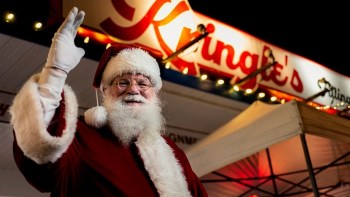 santa waves to kids at Kringles filling station a seattle christmas event downtown