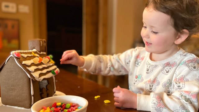 little girl using gingerbread house ideas
