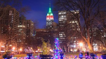 holiday lights in NYC with red-and-green lit Empire State Building in background