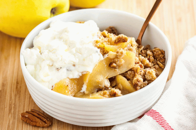 A bowl of maple apple crisp topped with ice cream makes a great alternative to pie for Thanksgiving dinner