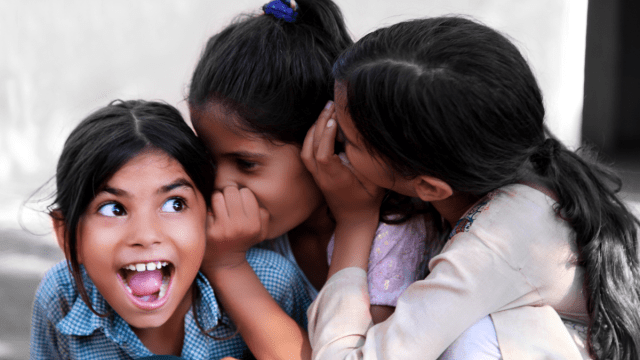 three girls laughing at jokes for kids