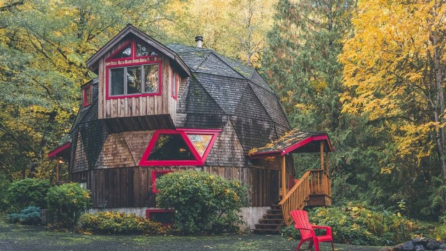 a charming dome cabin in Portland Oregon with red chairs and trim near mt hood
