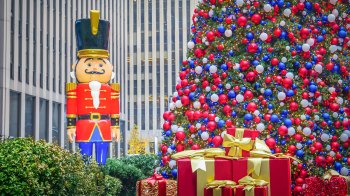 giant nutcracker and presents near Rockefeller Christmas Tree in New York City's Manhattan