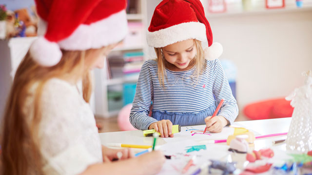 little girls drawing Christmas pictures