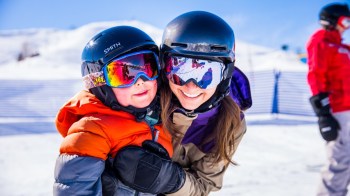 a mom and kid on a ski moutian in idaho a nearby winter getaway for seattle families