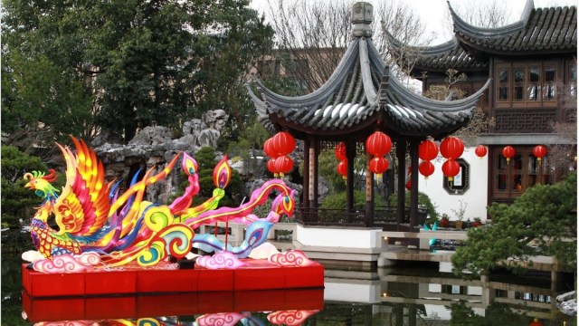 a dragon float on the water at Lan Su Chinese Garden in Portland is part of the Chinese New Year, Lunar New year Celebration