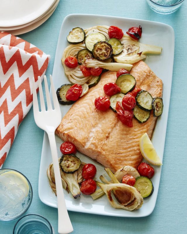 A Salmon Sheet Pan Dinner is on a plate ready to be served