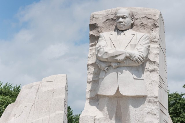 MLK monument with a cloudy blue sky in the background
