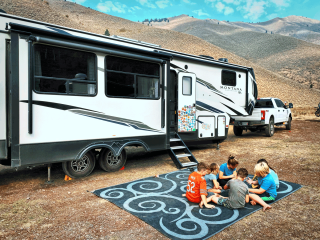 family camping in rv in the mountains