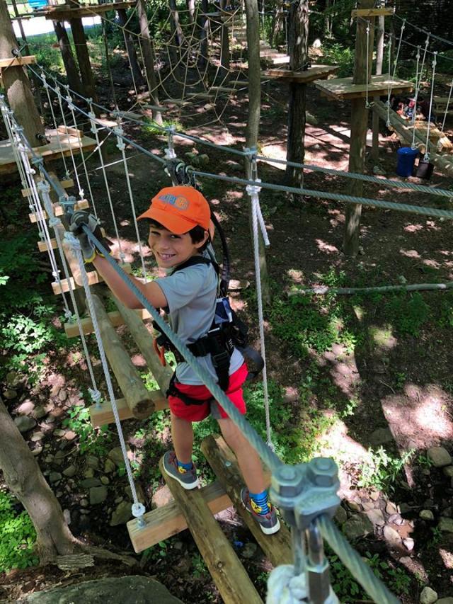 boy on ropes course in westchester