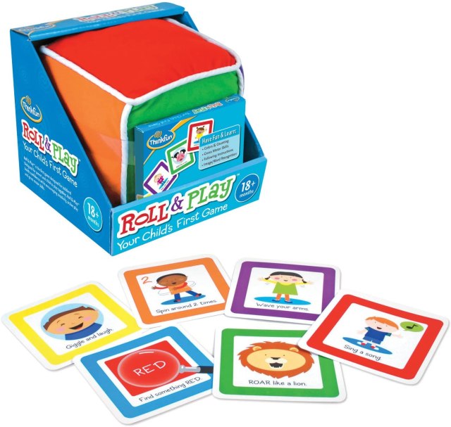 a colorful soft block sits in a blue box and cards are spread out in front of this toddler games